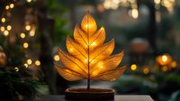 Glowing autumn leaf lamp on wooden base against blurred bokeh background creates cozy atmosphere. Decorative lighting for home interior design.