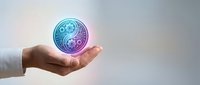 Hand holding glowing yin yang symbol with circuit board pattern representing balance between technology and spirituality in modern digital world.