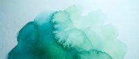 Abstract watercolor background with flowing teal and turquoise paint creating organic shapes and textures for artistic design projects.