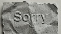 Word Sorry carved in stone texture, symbolizing sincere apology, regret, and forgiveness in relationships, business, or personal communication.