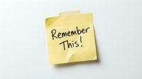 Remember This! handwritten text on isolated yellow sticky note against white background, ready for design use on presentations, websites, and marketing materials.