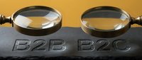 Magnifying glasses with B2B and B2C labels on dark surface against golden background for business comparison.