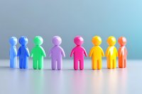 Colorful plastic figures standing in row symbolizing diversity, inclusion, unity and teamwork concept. Social community representation on light background.