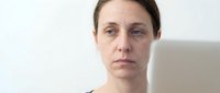 Tired exhausted woman with dark circles under eyes showing fatigue and stress in modern indoor setting for wellness and health concepts.