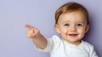 Cheerful baby in white shirt pointing finger against purple background, showing happy emotions with bright smile and blue eyes. Suitable for parenting blogs.