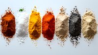 Colorful aromatic spice powders arranged in neat rows on white background, including paprika, salt, turmeric, chili, ginger, black pepper and cumin powder.