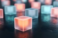 Glowing translucent cubes with warm orange and cool blue lighting create abstract geometric composition on dark surface for modern digital design concepts.