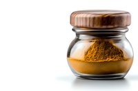 Ground turmeric powder in glass jar with wooden lid on white background, aromatic Indian spice for cooking and natural medicine, isolated with copy space.