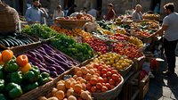 Fresh produce displayed at outdoor market stalls with vibrant vegetables, colorful fruits, and leafy greens arranged in wooden crates while shoppers browse selections.