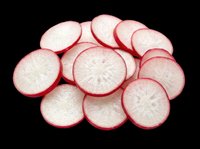Sliced radishes with vibrant red skin and white flesh, isolated on transparent background. Ready for culinary designs, recipe graphics, food packaging, print-on-demand products, and kitchen-themed clipart.