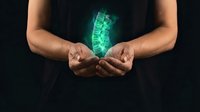 Hands cupping glowing green spine hologram representing spinal health, chiropractic care, medical technology and orthopedic treatment concepts.