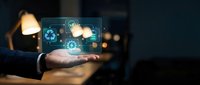 Businessperson holding glowing digital interface with recycling and gear icons, representing sustainable technology, green innovation, and eco-friendly business solutions.