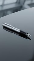 Sleek silver and black fountain pen resting on a reflective gray surface with blurred office background, suitable for business, writing, and professional design projects.
