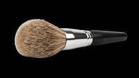 Makeup brush with natural bristles, metal ferrule, and black handle isolated on transparent background. Ready for clipart, design elements, print-on-demand, and sublimation projects.