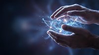 Hands holding glowing blue energy between palms, representing power, technology, innovation, and digital connection for business and science concepts.