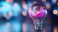 Light bulb with glowing pink stock market chart inside on blurred blue and gold bokeh background, creative business and investment concept.