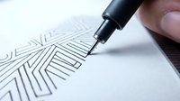 Hand drawing geometric line pattern with black ink pen on white paper, creating abstract linear design for art, illustration, and creative projects.