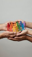 Diverse hands holding colorful paper cutout figures in rainbow colors, symbolizing unity, teamwork, community support, and inclusive collaboration for nonprofit and social causes.