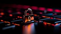 Glowing padlock on illuminated gaming keyboard with red and blue backlighting, symbolizing cybersecurity and data protection in digital technology.