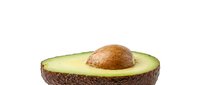 Fresh ripe avocado half with pit isolated on white background for healthy cooking and nutrition concepts.