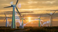 Wind turbines generating renewable energy with wireless connectivity symbols at golden sunset over green field for sustainable technology concepts.