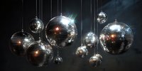 Shiny disco balls hanging from ceiling with reflective surfaces creating light patterns in dark nightclub atmosphere. Perfect for party decoration.