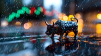 Miniature bull figurine on wet street reflecting city lights during rain, with festive Christmas decorations and bokeh creating magical holiday atmosphere.
