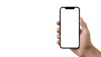 Hand holding modern smartphone with blank white screen isolated on white background for mockup and app presentation purposes.