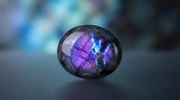 Polished labradorite gemstone displaying vibrant purple and blue iridescent flashes on smooth surface with soft bokeh background for jewelry design.