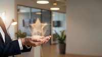 Businessman hand holding glowing golden star rating symbol in modern office environment representing excellence customer satisfaction and quality service.