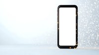 Modern smartphone with blank white screen on light background with glitter bokeh effect, isolated mockup for app and web design presentation.