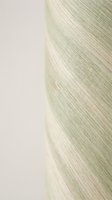 Close-up of blonde hair strands showing natural texture and shine against neutral background for beauty and haircare concepts.