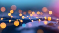 Glowing network connections with blurred bokeh lights creating futuristic technology concept against dark blue and purple background. Modern digital infrastructure.