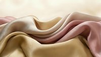 Flowing silk fabric waves in soft pastel colors creating elegant textile background with smooth curves and luxurious draping for fashion design projects.