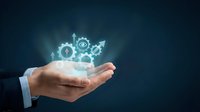 Business hand holding glowing digital icons representing growth, strategy and innovation concepts for corporate presentations and marketing materials.