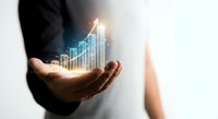 Business professional holding glowing digital growth chart with upward arrow showing financial success and data analytics for corporate presentations.
