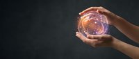 Hand holding glowing orb with purple and orange light against dark background, representing future technology, innovation, and digital transformation concepts.