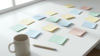 Colorful sticky notes scattered on white desk with coffee mug and pencil for brainstorming and planning sessions in modern office workspace.