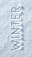 Word WINTER written in fresh white snow surface, top view flat lay. Seasonal cold weather concept for holiday cards and banners.
