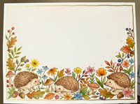 Hedgehogs surrounded by autumn flowers and foliage on cream background, isolated design element suitable for stationery, invitations, and craft projects.