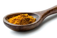 Ground turmeric powder in wooden spoon on white background, bright yellow organic spice used in Asian cuisine and natural medicine, macro food photography.