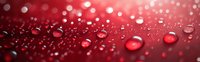 Water drops on red surface with bokeh light effects creating romantic atmosphere. Macro photography shows crystal clear liquid beads against vibrant crimson background.