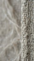 Natural jute rope close-up showing detailed fiber texture and weave pattern for nautical, rustic and craft projects with soft blurred background.