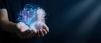 Hands holding glowing digital hologram with network connections and data visualization, representing technology innovation and cloud computing solutions.