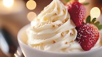 Creamy vanilla soft serve ice cream swirled in white bowl with fresh red strawberries and golden bokeh lights creating luxurious dessert atmosphere.