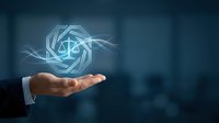 Businessman hand holding glowing legal scale symbol with digital light effects, representing justice, law, compliance, and corporate governance in professional environment.