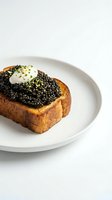 Gourmet caviar toast with creamy dollop and microgreens on white ceramic plate, luxury seafood appetizer for fine dining and upscale restaurant menus.