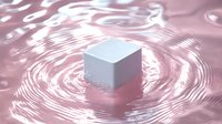 White geometric cube floating on rippled pink liquid surface creating concentric circles in soft pastel tones, minimalist composition for modern design projects.