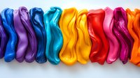 Colorful wavy lines of vibrant modeling clay arranged in rainbow sequence on white background, creating abstract artistic composition for creative design projects.