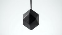 Black geometric hexagonal pendant lamp hanging from ceiling cable against white background for modern interior lighting design.